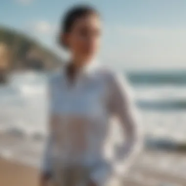 Anetik sun shirt displayed against a backdrop of ocean waves