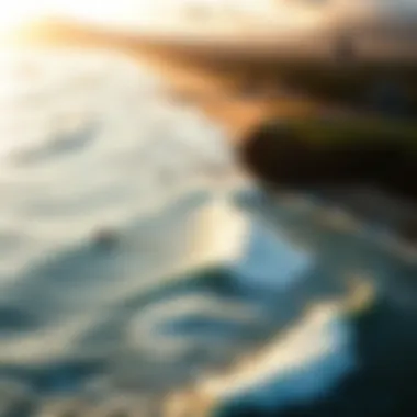 An aerial shot of surfers riding the waves at Sunset Beach.
