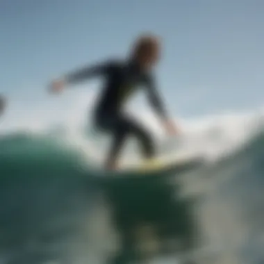 A surfer donning the Billabong Absolute Wetsuit while riding a wave.