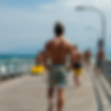 A scenic view of a boardwalk with individuals wearing shorts during a watersport activity.