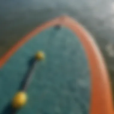 Close-up of the paddle board's textured surface showing design features