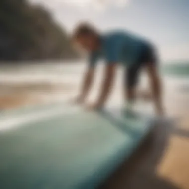 Surfer maintaining their board with care