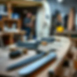 An array of surfboard shaping tools laid out on a workbench.