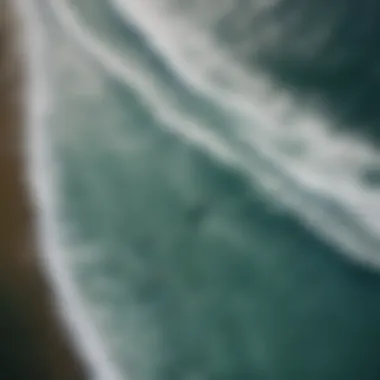 Aerial view of a surfer gliding above the water on a board