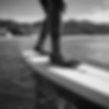 Black and White Stance Socks on Surfboard Stylish black and white stance socks showcased on a surfboard