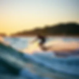 Skimboarder gliding along the shore