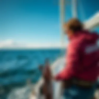 A person steering a sailboat, embodying the spirit of adventure and exploration on water