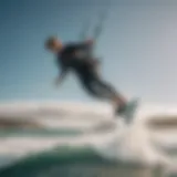 A kitesurfer performing a jump over the waves