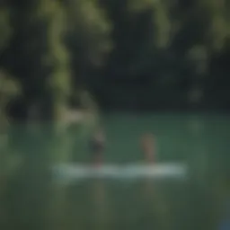 A serene lake view with paddleboarders exploring the water.