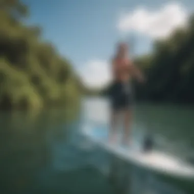 An instructor demonstrating paddleboarding techniques.