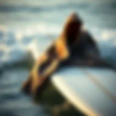 A stylish surf poncho towel draped over a surfboard