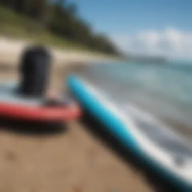 Close-up of paddleboard equipment on the beach