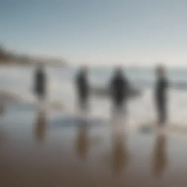 Group of surfers discussing techniques along the shoreline