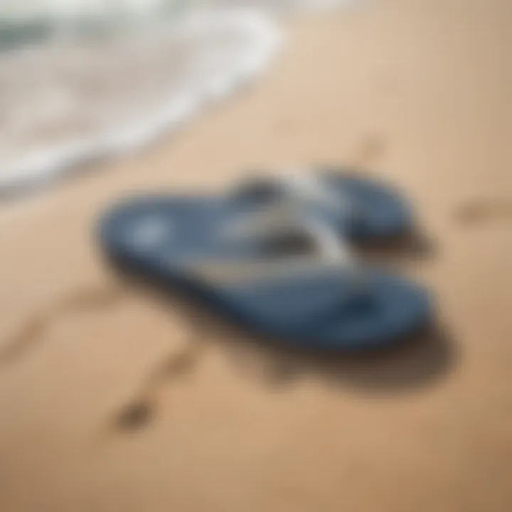 Reef Cushion Slim flip flops on a sandy beach