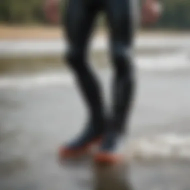 A person wearing wetsuit boots while engaging in watersports, demonstrating their functionality