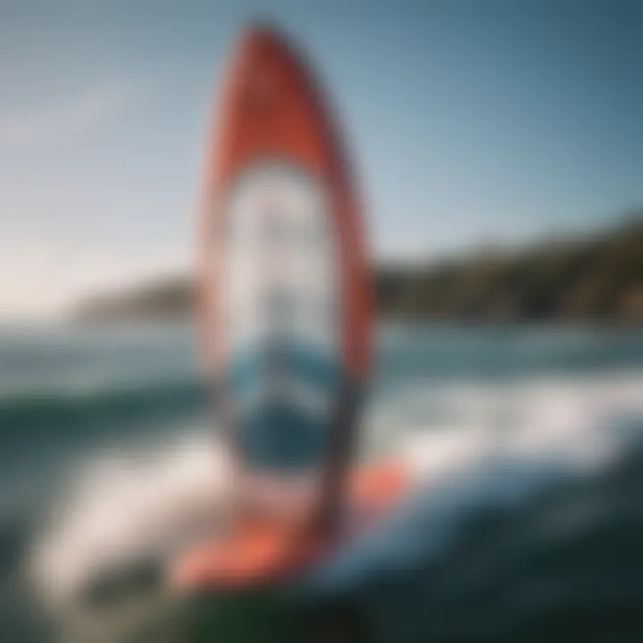 An advanced inflatable windsurfboard showcasing its streamlined design and vibrant colors on water.