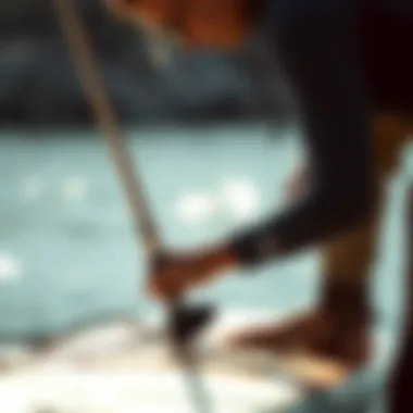 Expert demonstrating proper maintenance techniques for Naish foils