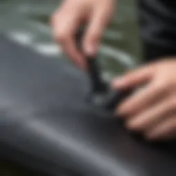 Close-up of neoprene repair glue application on wetsuit