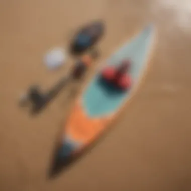 Essential Paddle Surfing Gear An intricate view of paddle surfing gear laid out on the sandy shore, highlighting essential equipment.
