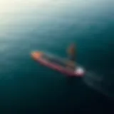 A self-propelled stand-up paddle board gliding smoothly on a serene water surface