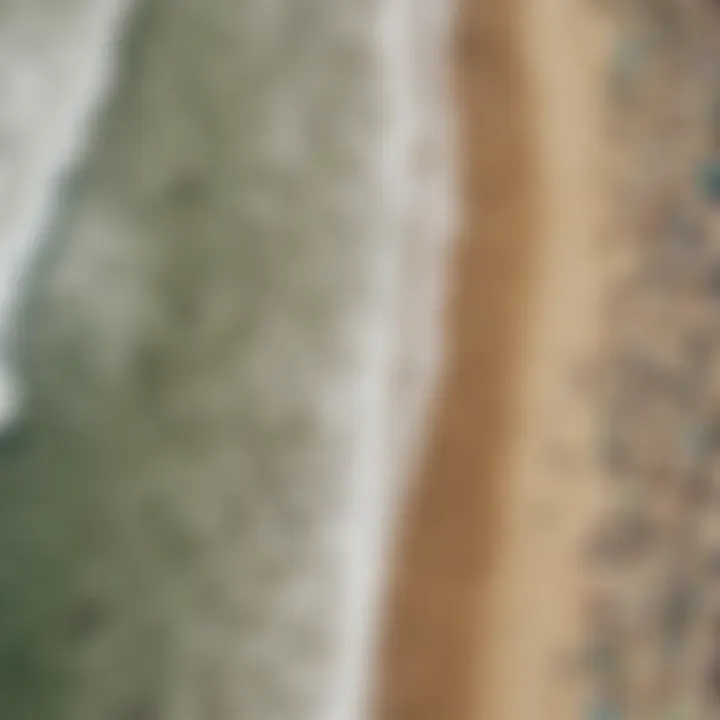 An aerial view of a bustling beach with surfers and spectators