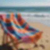 A vibrant surf poncho draped over a beach chair, showcasing its fabric