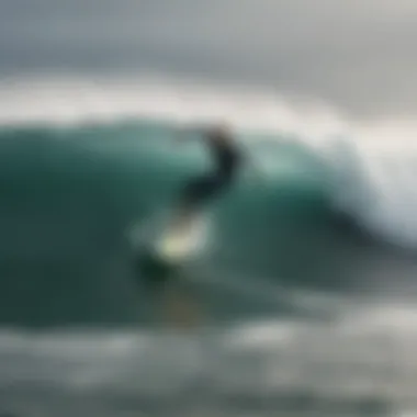 Surfboarders riding waves on a windy day