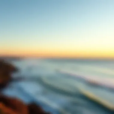 Beautiful sunrise over Sydney's coastline with surfers