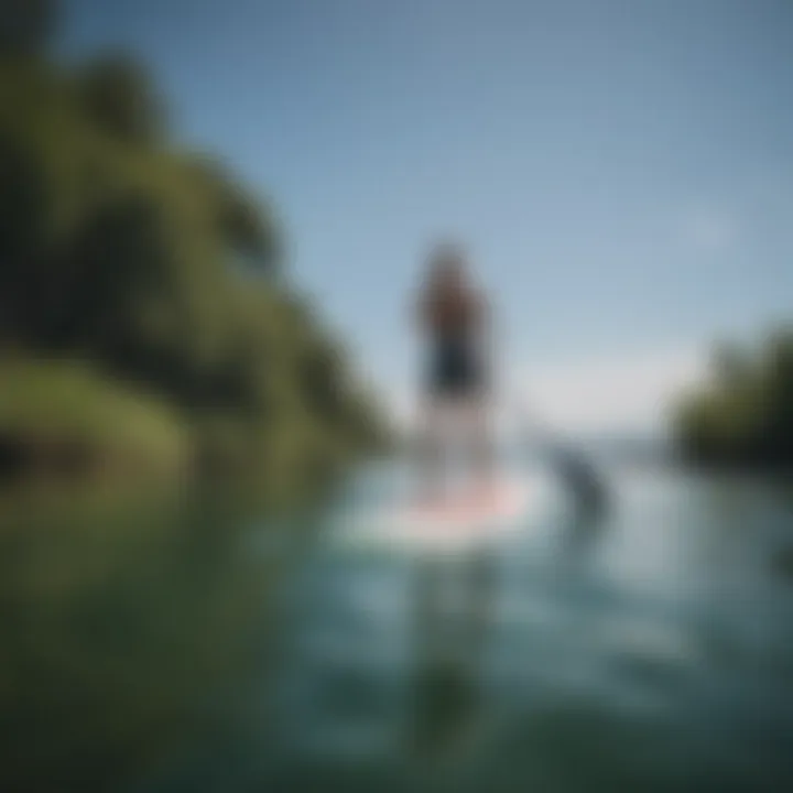 An individual paddleboarding in serene waters