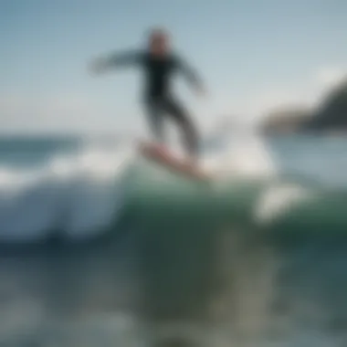 A surfer executing an ollie on a wave