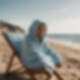 Stylish hooded towel draped on a beach chair