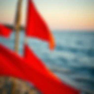 A serene beach scene with warning flags for swimming safety.