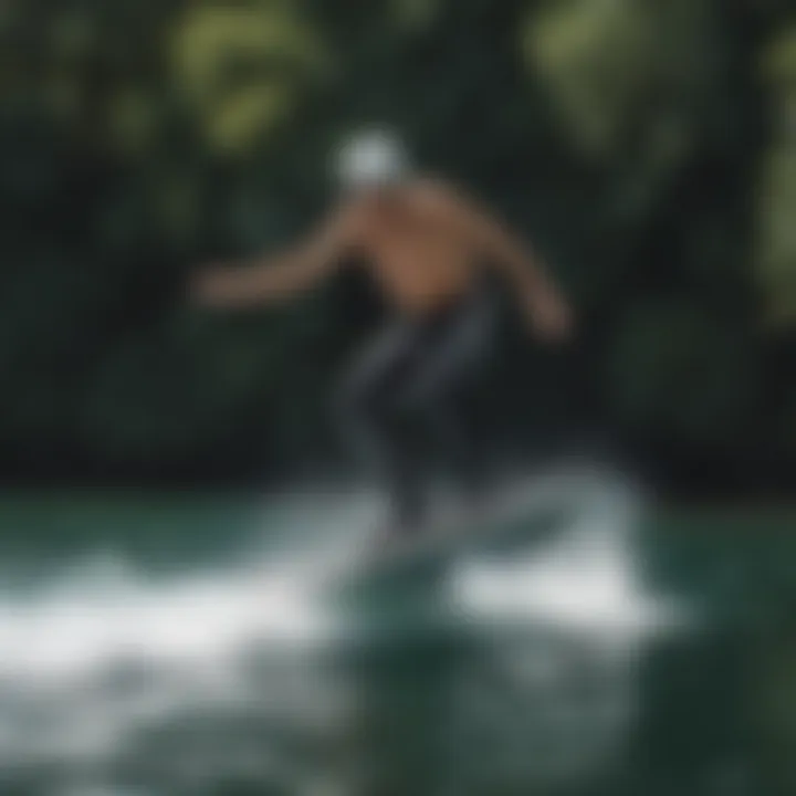 A water sports enthusiast riding a foilboard, demonstrating its performance.