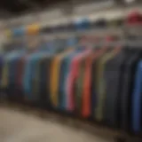 A dynamic view of various wetsuit tops displayed on a rack, showcasing their diverse styles and colors.